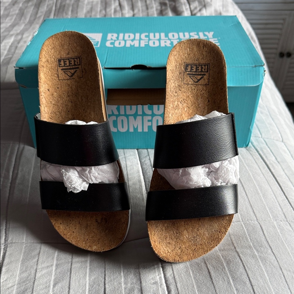 Black sandal, two straps worn one time